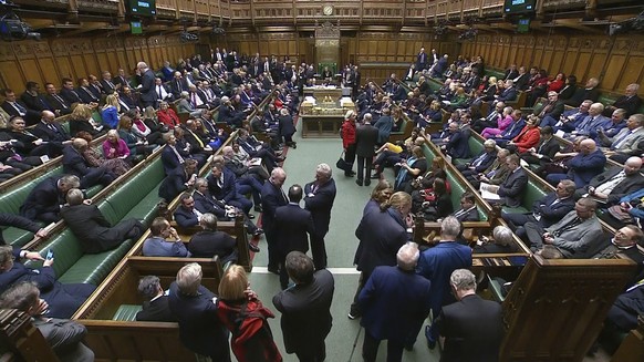 MP&#039;s gather in the House of Commons ahead of the second reading vote, in London, Tuesday, Dec. 12 2023. U.K. Prime Minister Rishi Sunak is trying to cajole recalcitrant lawmakers into supporting  ...