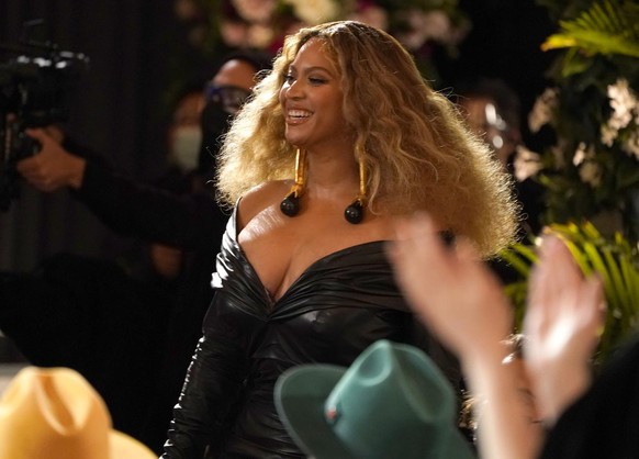 Beyonce appears in the audience before accepting the award for best rap song for &quot;Savage&quot; at the 63rd annual Grammy Awards at the Los Angeles Convention Center on Sunday, March 14, 2021. (AP ...