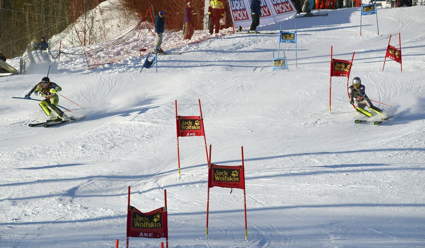 Sweden&#039;s Andre Myhrer, left, and France&#039;s Julien Lizeroux compete during the Team Event, at the alpine ski World Cup finals in Are, Sweden, Friday, March 16, 2018. (AP Photo/Alessandro Trova ...