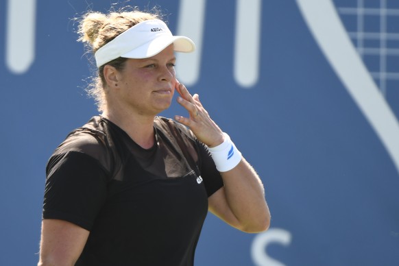 FILE - Kim Clijsters, of Belgium, misses a shot against Su-Wei Hsieh, of Taiwan during her first round match in the Chicago Fall Tennis Classic tournament, Sept. 27, 2021, in Chicago. Four-time Grand  ...