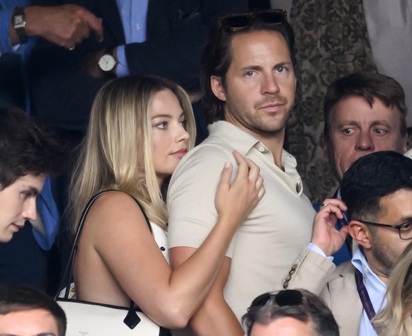 LONDON, ENGLAND - JULY 12: Margot Robbie and Tom Ackerley court-side of Centre Court on day twelve of the Wimbledon Tennis Championships at the All England Lawn Tennis and Croquet Club on July 12, 202 ...