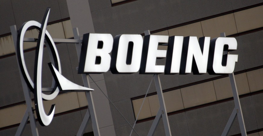 FILE - The Boeing logo is seen, Jan. 25, 2011, on the property in El Segundo, Calif. A Boeing 737-800 was found to have a missing panel after a United Airlines flight arrived at its destination in sou ...