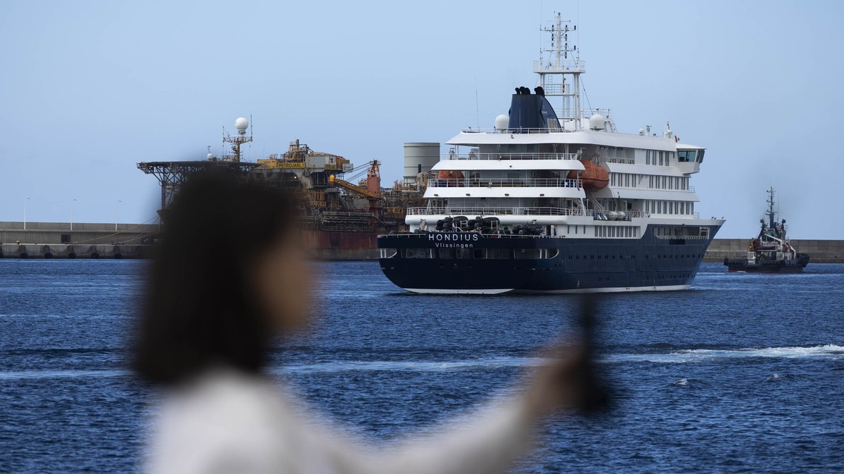 epa12947353 MV Hondius is seen at the port in Granadilla de Abona, Tenerife, Canary Islands, Spain, 11 May 2026, as Spanish authorities hold a press conference to provide updates on the evacuation of  ...