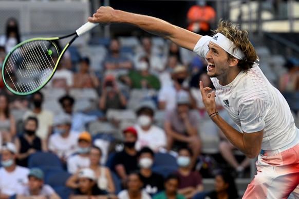 epa09699139 Alexander Zverev of Germany in action against Radu Albot of Moldova in their third round match of the Australian Open Tennis Tournament at Melbourne Park in Melbourne, Australia, 21 Januar ...