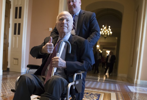 FILE - In this Dec. 1, 2017 file photo, Sen. John McCain, R-Ariz., leaves a closed-door session where Republican senators met on the GOP effort to overhaul the tax code, on Capitol Hill in Washington. ...