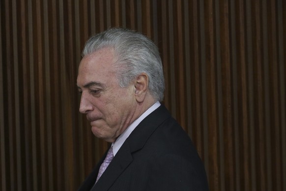 FILE - In this Dec. 5, 2016, file photo, Brazil&#039;s President Michel Temer arrives for a pension plan proposal to National Congress leaders, at the Planalto Presidential Palace, in Brasilia, Brazil ...