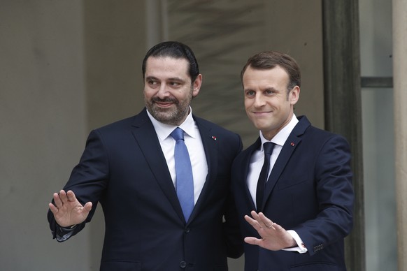 French President Emmanuel Macron, right, poses for photographers with Lebanon&#039;s Prime Minister Saad Hariri prior to their meeting at the Elysee Palace in Paris, Saturday, Nov. 18, 2017. Hariri ar ...