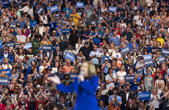 epa11557330 A crowd of people listen to Democratic presidential candidate US Vice President Kamala Harris during a campaign rally at Fiserv Arena in Milwaukee, Wisconsin, USA, 20 August 2024. The rall ...