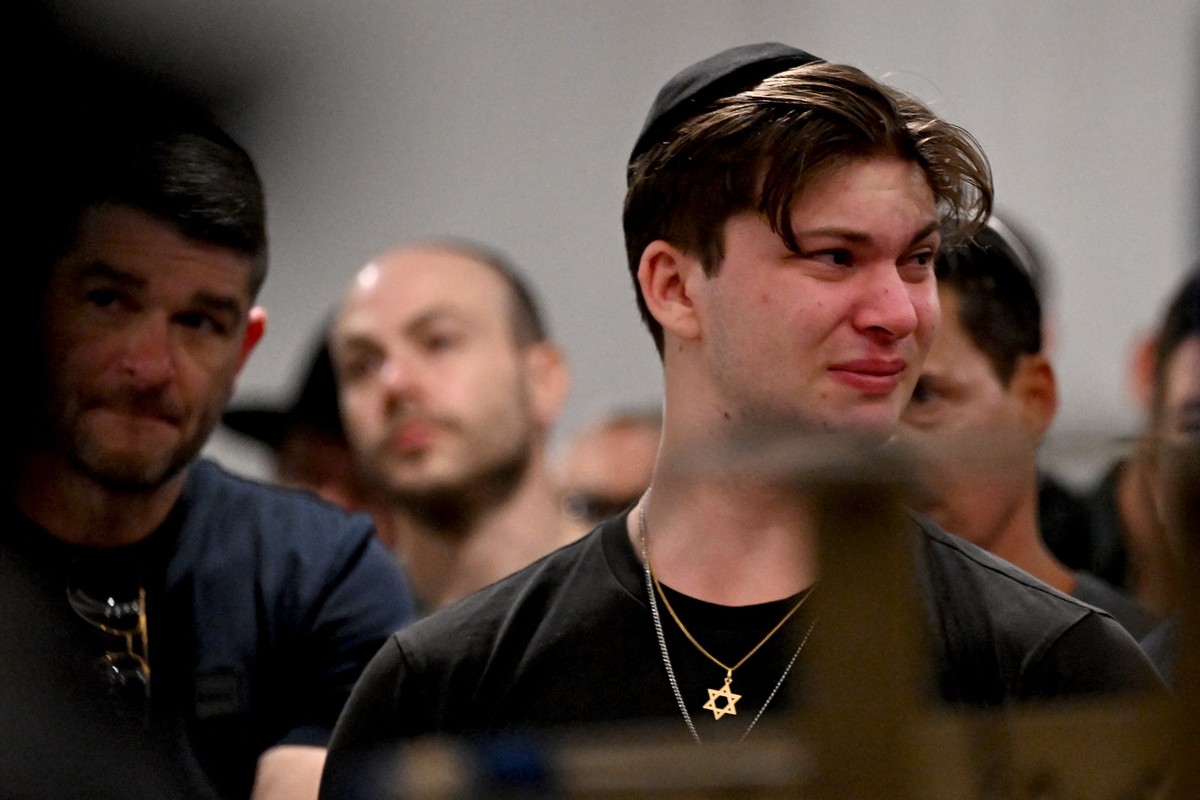 Members of the Jewish community attend a vigil at the Chabad of Bondi for the victims of a shooting at Bondi Beach, in Sydney on December 15, 2025. Australia's leaders agreed on December 15 to to ...