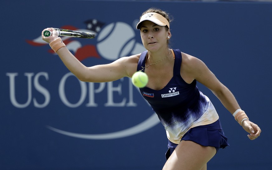 Belinda Bencic, of Switzerland, returns a shot to Andrea Petkovic, of Germany, during the second round of the U.S. Open tennis tournament, Wednesday, Aug. 31, 2016, in New York. (AP Photo/Frank Frankl ...