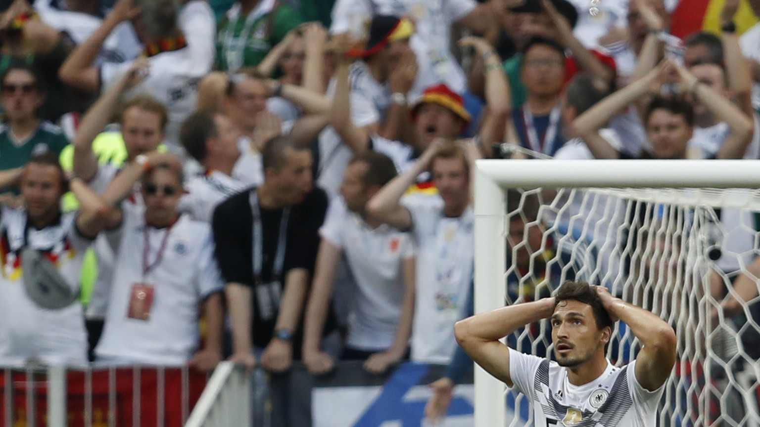 Germany&#039;s Mats Hummels reacts along with Germany fans after Germany&#039;s loss to Mexico in their group F match at the 2018 soccer World Cup in the Luzhniki Stadium in Moscow, Russia, Sunday, Ju ...