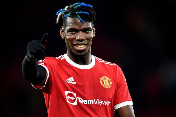 epa09535108 Manchester United&#039;s Paul Pogba reacts after winning the UEFA Champions League group F soccer match between Manchester United and Atalanta BC in Manchester, Britain, 20 October 2021. E ...