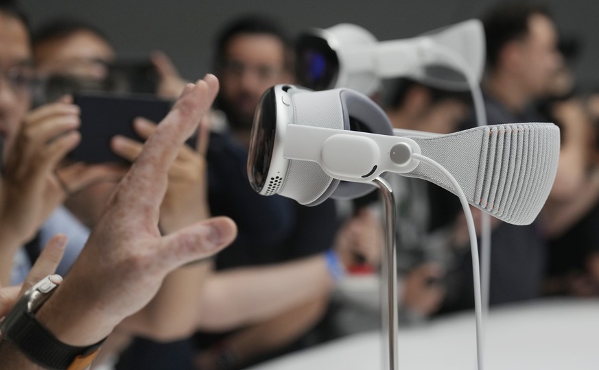 The Apple Vision Pro headset is displayed in a showroom on the Apple campus in Cupertino, Calif., at the company&#039;s annual developers conference, Monday, June 5, 2023. (AP Photo/Jeff Chiu)