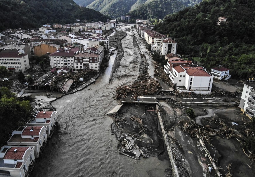 An aerial photo shows destroyed buildings after floods and mudslides killed about two dozens of people, in Bozkurt town of Kastamonu province, Friday, Aug. 13, 2021. Heavy rainfalls that pounded the B ...