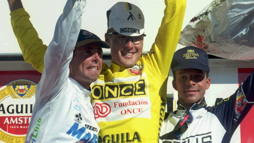 Swiss cyclists Alex Zuelle (center), Tony Rominger (left) and Laurent Dufaux share the podium on the last stage of the Tour of Spain cycling race after they came in first, second and third respectivel ...