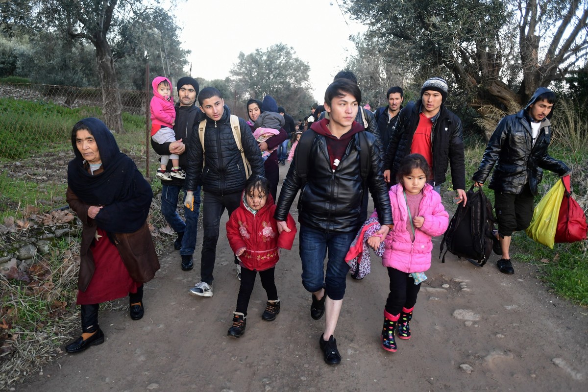 Migrants arrive at the village of Skala Sikaminias, on the Greek island of Lesbos, after crossing on a dinghy the Aegean sea from Turkey on Monday, March 2, 2020. Thousands of migrants and refugees ma ...