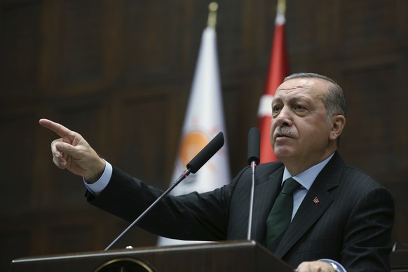 Turkey&#039;s President Recep Tayyip Erdogan gestures as he delivers a speech during a meeting of his ruling Justice and Development Party (AKP), in Ankara, Turkey, Tuesday, Dec. 5, 2017. Erdogan says ...