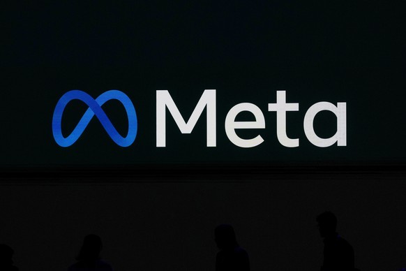 FILE - A Meta logo is shown on a video screen at LlamaCon 2025, an AI developer conference, in Menlo Park, Calif., April 29, 2025. (AP Photo/Jeff Chiu, File)
Meta LlamaCon