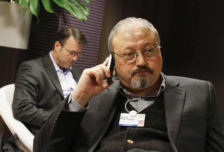 FILE - In this Jan. 29, 2011 file photo, Saudi journalist Jamal Khashoggi speaks on his cellphone at the World Economic Forum in Davos, Switzerland. Eighteen days after Khashoggi disappeared, Saudi Ar ...