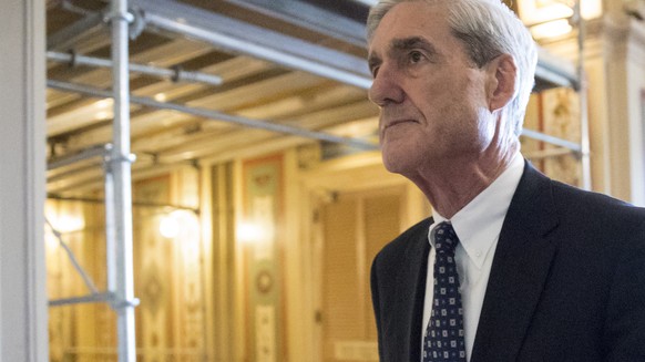 FILE - In this June 21, 2017, file photo, special counsel Robert Mueller departs after a meeting on Capitol Hill in Washington. America has waited a year to hear what Mueller concludes about the 2016  ...