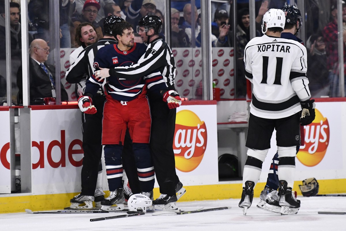 Winnipeg Jets' Nino Niederreiter looks over at Los Angeles Kings' Anze Kopitar (11) after fighting Adrian Kempe .during the second period of an NHL hockey game in Winnipeg, Manitoba, on Tues ...