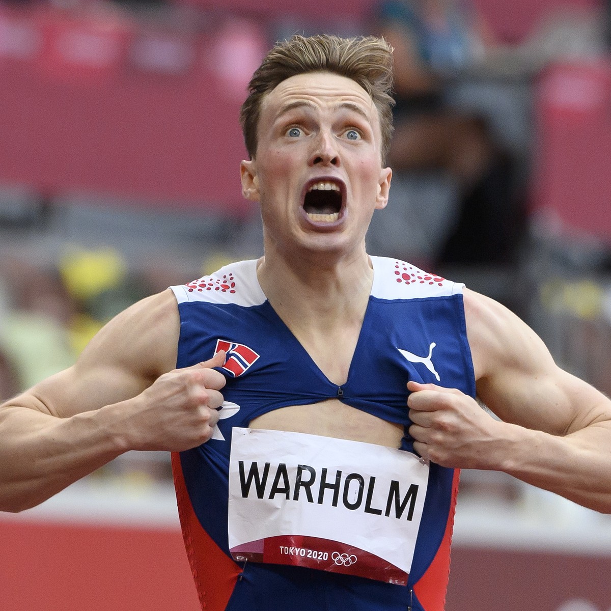 epaselect epa09389297 Karsten Warholm of Norway celebrates after winning the Men's 400m Hurdles final at the Athletics events of the Tokyo 2020 Olympic Games at the Olympic Stadium in Tokyo, Japa ...