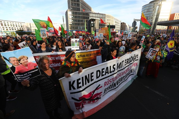 epa07054725 Protesters attend a demonstration against the Turkish president, in Berlin, Germany, 28 September 2018. The demonstrators, affiliated with Kurdish groups, Turkish opposition, antifascists  ...