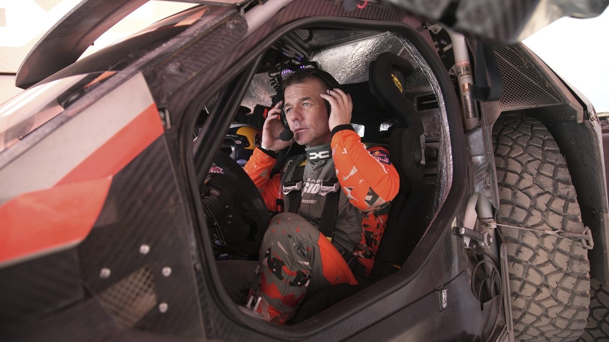 French racing driver Sebastien Loeb gets out his Dacia Sandrider after a training twp days before the start of the Dakar Rally in Bisha, Saudi Arabia, Wednesday, Jan. 1, 2025. (AP Photo/Christophe Ena ...