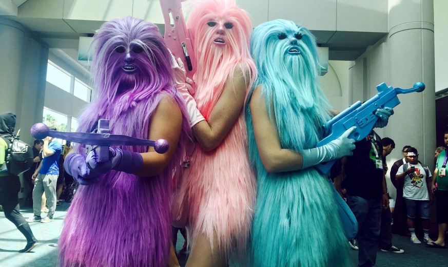FILE - In this July 10, 2015 file photo, fans dressed as &quot;Chewie's Angels&quot; attend day 2 of Comic-Con International, in San Diego, Calif. Star Wars inspires curiously personal reactions. It  ...