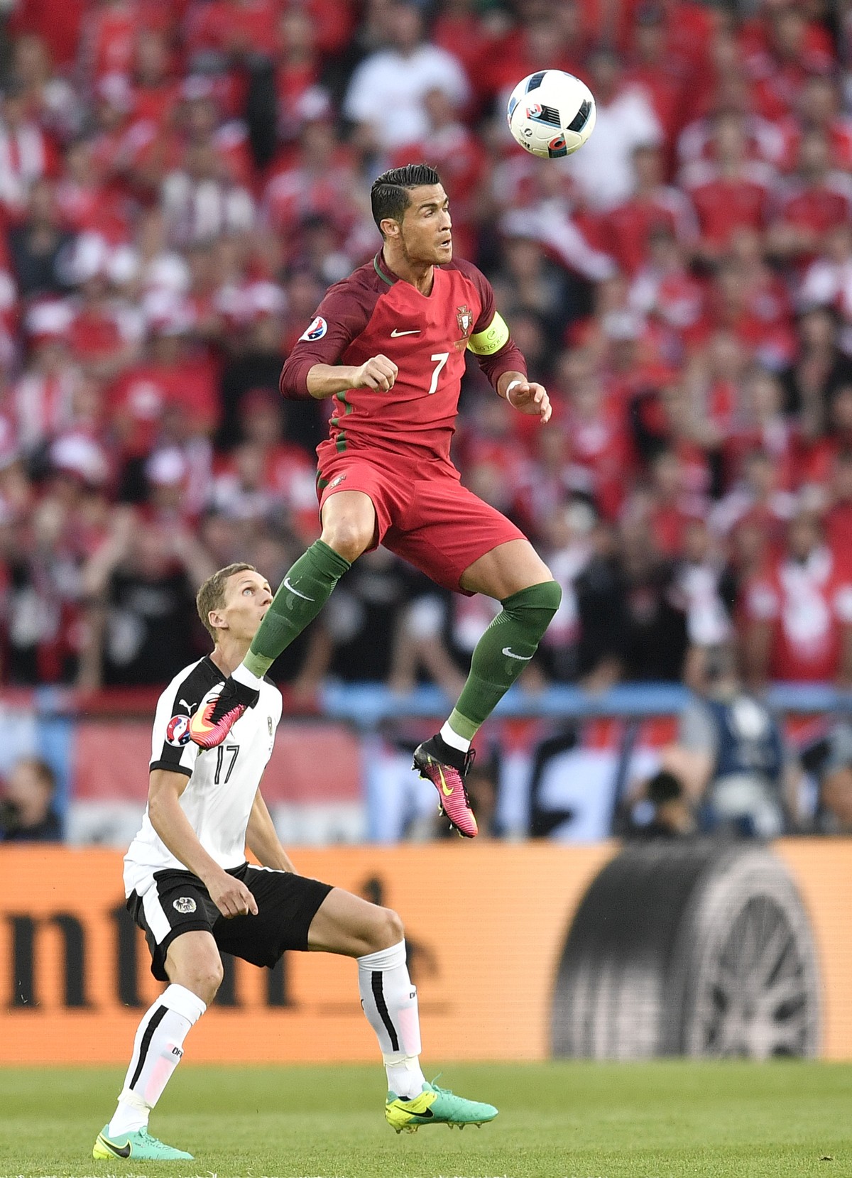 Portugal's Cristiano Ronaldo jumps for the ball during the Euro 2016 Group F soccer match between Portugal and Austria at the Parc des Princes stadium in Paris, France, Saturday, June 18, 2016. ( ...