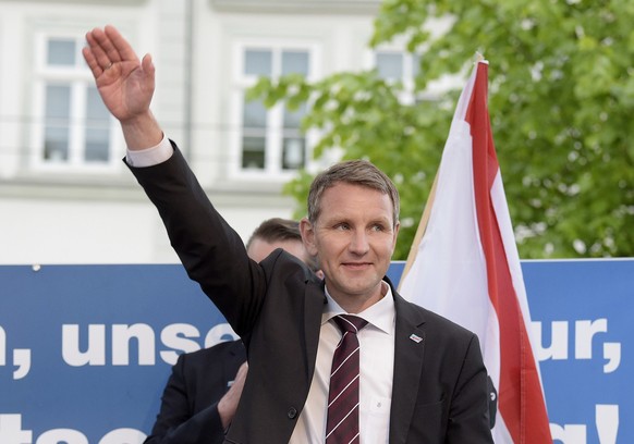 Head of AfD in Thuringia Bjoern Hoecke waves during a rally of nationalist Alternative for Germany against the planned building of a mosque in Erfurt, eastern Germany, Wednesday, May 18, 2016. (AP Pho ...
