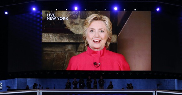 epa05442846 US Democratic Presidential Nominee Hillary Clinton is seen displayed in a screen as she delivers remarks in the Wells Fargo Center on day 2 of the 2016 Democratic National Convention (DNC) ...