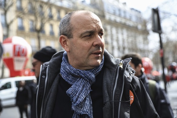 French Democratic Confederation of Labour (CFDT) union's general secretary Laurent Berger walks during a rally in Paris, Thursday, march 23, 2023. French unions are holding their first mass demon ...
