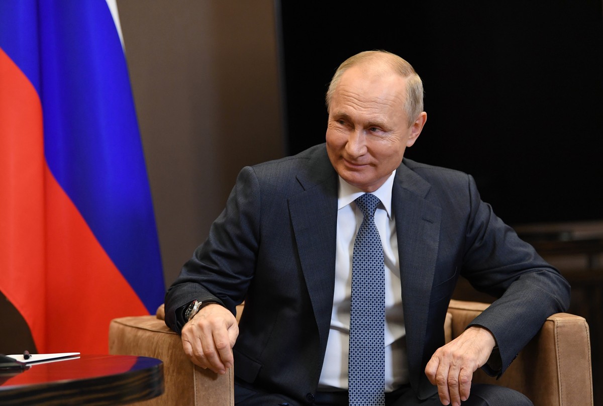 Russian President Vladimir Putin listens to Aslan Bzhania, leader of Georgia's breakaway province of Abkhazia during their meeting in the Bocharov Ruchei residence in the Black Sea resort of Soch ...
