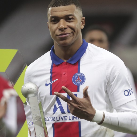 PSG&#039;s Kylian Mbappe holds the trophy for the best scorer of the league after the French League One soccer match between Brest and Paris Saint-Germain at the Stade Francis-Le Ble stadium in Brest, ...