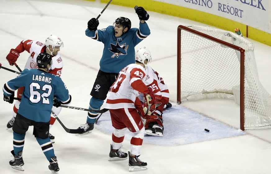 San Jose Sharks right wing Timo Meier, top center, celebrates after scoring against the Detroit Red Wings during the third period of an NHL hockey game Monday, March 12, 2018, in San Jose, Calif. (AP  ...