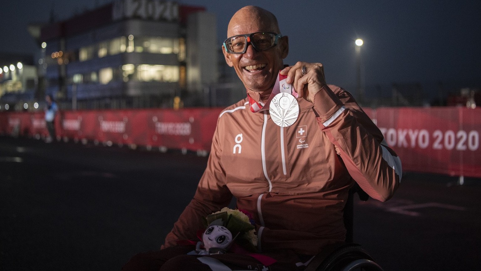 Heinz Frei of Switzerland poses with his silver medal after the Men&#039;s H3 Race competition at the 2020 Tokyo Summer Paralympics Games at the Fuji International Speedway in Fuji, Japan, Wednesday,  ...