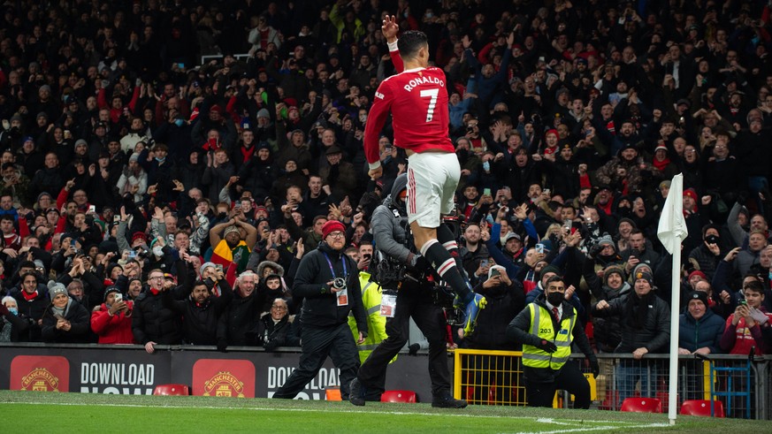 epa09617722 Manchester United&#039;s Cristiano Ronaldo celebrates after scoring the 2-1 during the English Premier League soccer match between Manchester United and Arsenal FC in Manchester, Britain,  ...