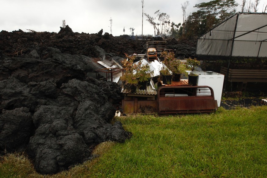 Lava continues to overrun property along Hookupu Street, Monday, May 7, 2018, in Pahoa, Hawaii. Hawaii&#039;s Kilauea volcano has destroyed homes and spewed lava hundreds of feet into the air, leaving ...