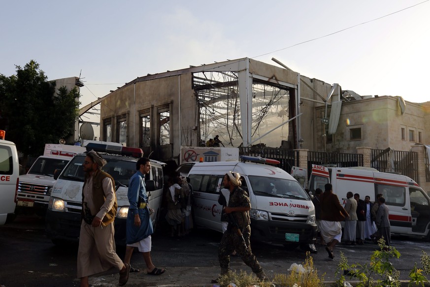 epa05576805 Yemenis inspect the site of Saudi-led airstrikes that hit a funeral ceremony in Sanaa, Yemen, 08 October 2016. According to reports, at least 82 Yemenis were killed and more than 534 inju ...