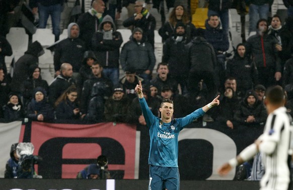 Real Madrid&#039;s Cristiano Ronaldo celebrates after scoring his side&#039;s opening goal during the Champions League first leg quarter final soccer match between Juventus and Real Madrid, at Juventu ...