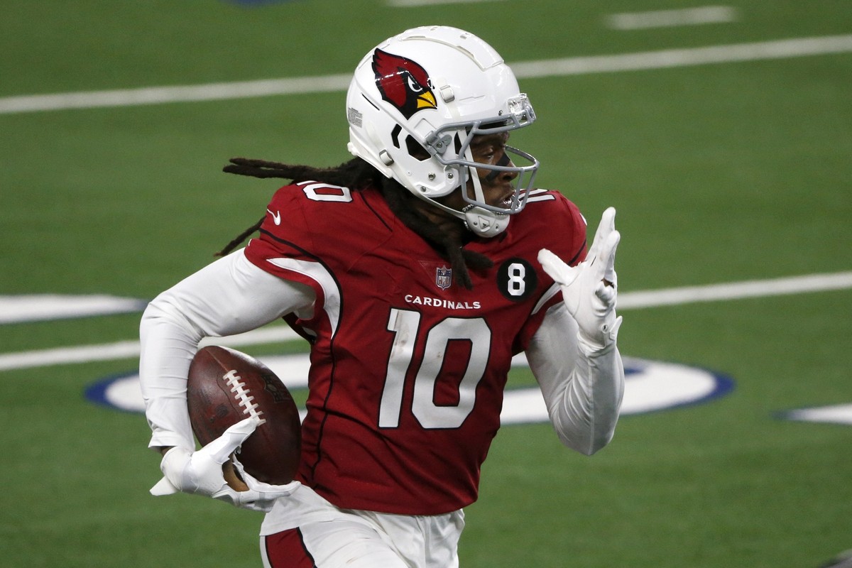 Arizona Cardinals wide receiver DeAndre Hopkins (10) gains yardage after catching a pass in the second half of an NFL football game against the Dallas Cowboys in Arlington, Texas, Monday, Oct. 19, 202 ...