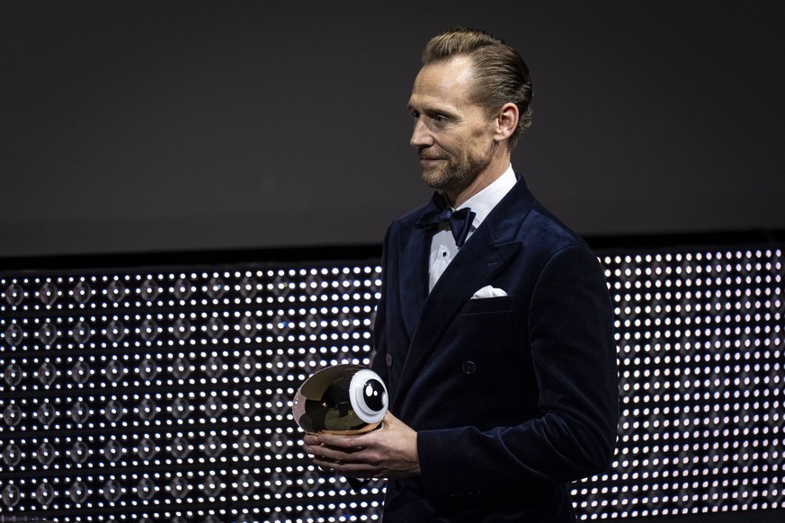 epa13260785 British actor Tom Hiddleston receives the Golden Eye Award during the Opening Night of the 22nd Zurich Film Festival (ZFF) in the Zurich Convention Center in Zurich, Switzerland, 24 Septem ...