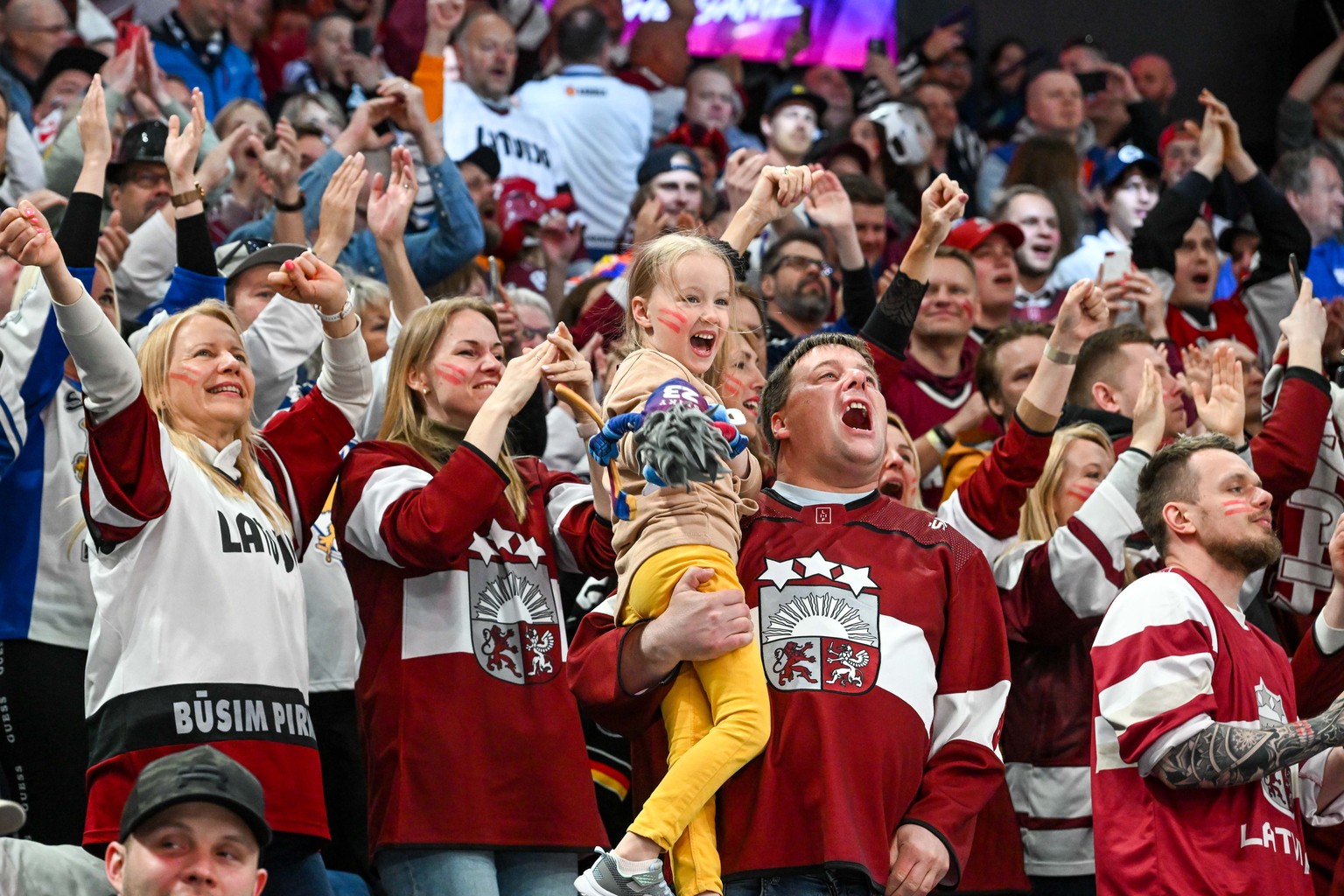 epa10659945 Fans of team Latvia cheer during the bronze medal game between Latvia and the USA at the IIHF Ice Hockey World Championship 2023 in Tampere, Finland, 28 May 2023. EPA/KIMMO BRANDT