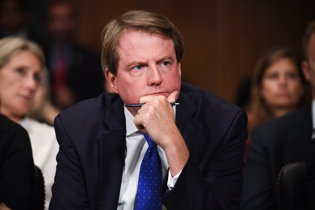 epa07052943 White House Counsel and Assistant to the President for US President Donald Trump, Donald McGahn, listens to Supreme Court nominee Brett Kavanaugh (unseen) as he testifies before the Senate ...