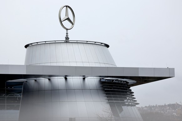 epa11172233 The Mercedes logo pictured atop the headquarters of Mercedes-Benz AG, in Stuttgart, Germany, 22 February 2024. The Mercedes-Benz Group holds their annual press conference on 22 February 20 ...