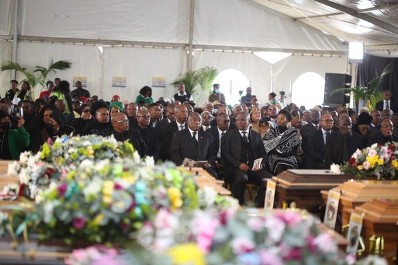 epa10054498 South African President Cyril Ramaphosa (C) and other dignitaries mourn at the coffins of the 21 young victims who died after a &#039;Pens down&#039; after school party in Enyobeni Tavern  ...