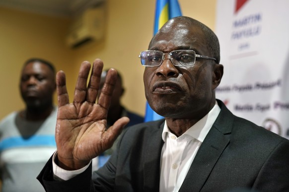 Opposition candidate Martin Fayulu speaks to the press at his headquarters in Kinshasa, Congo, Thursday Jan. 10, 2019. Fayulu, who came second in the presidential poll behind Felix Tshisekedi, called  ...