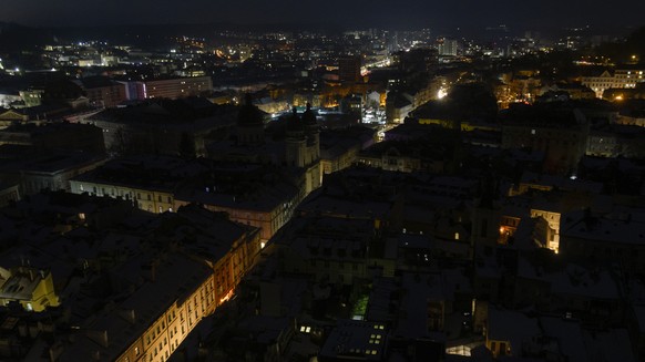 epa12721114 Image taken from an elevated position at the town hall shows the dark city centre during a power cut in Lviv, Western Ukraine, 09 February 2026, amid the ongoing Russian invasion. All of U ...