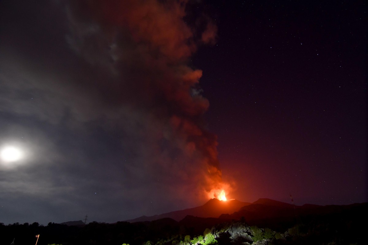 epa11480944 The Mount Etna volcano spews lava during an eruption in Sicily island, Italy, 15 July 2024 (issued 16 July 2024). Mount Etna's Voragine crater spewed lava through the night, with a co ...